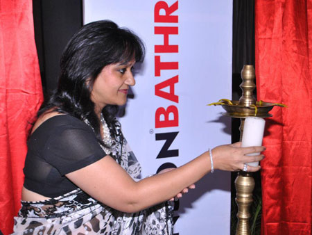 Lighting the inaugural lamp as the Guest of Honour